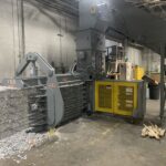 Your Shred Program Is a Materials Handling Problem, Not Just a Security One American 5029H9T30-4 baler baling shredded paper into bales