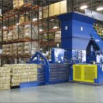 OCC Prices Are Up. Is Your Baler Bale Quality Keeping Pace? Auto-tie baler producing dense cardboard bales in a warehouse
